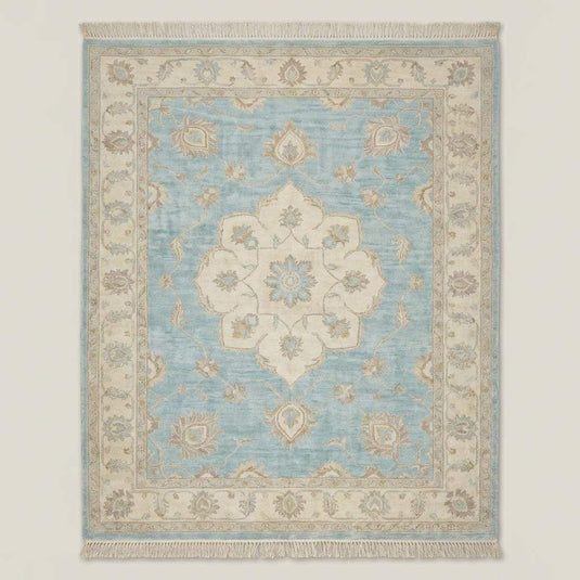 Translation missing: en.Traditional Oushak style wool rug with ivory border and floral vine motifs