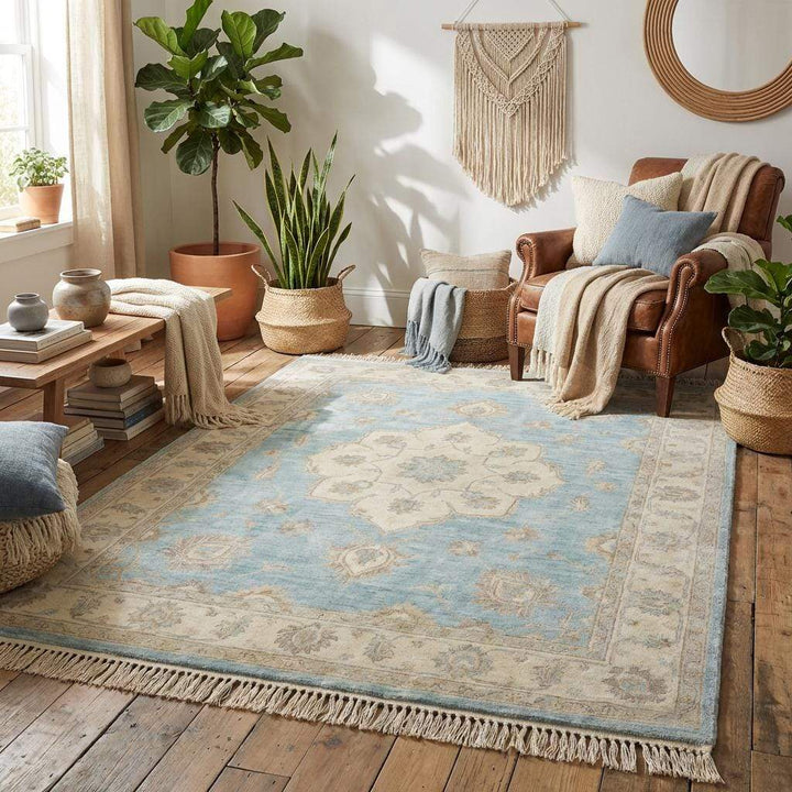 Translation missing: en.Light blue handmade wool rug styled in elegant living room with neutral furniture