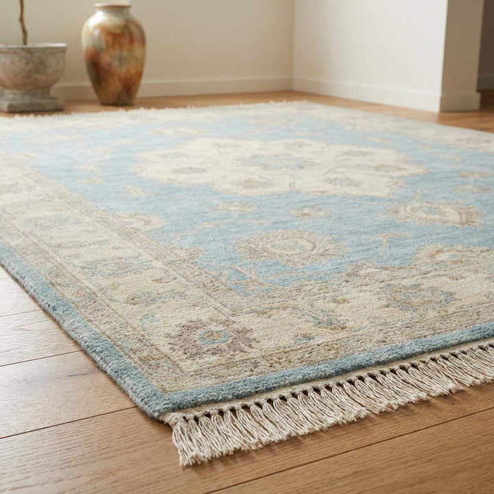 Translation missing: en.Artisan hand knotted area rug featuring classic medallion design and muted tones