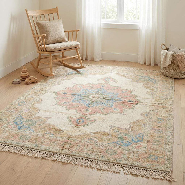 Translation missing: en.Living room styled with neutral furniture and hand knotted pastel area rug
