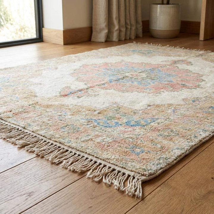 Translation missing: en.Traditional Oushak style rug featuring ivory base with blush and blue accents