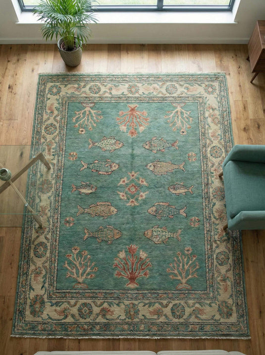 Translation missing: en.Hand-knotted Persian fish motif wool rug in teal with coral accents, artisan crafted and durable