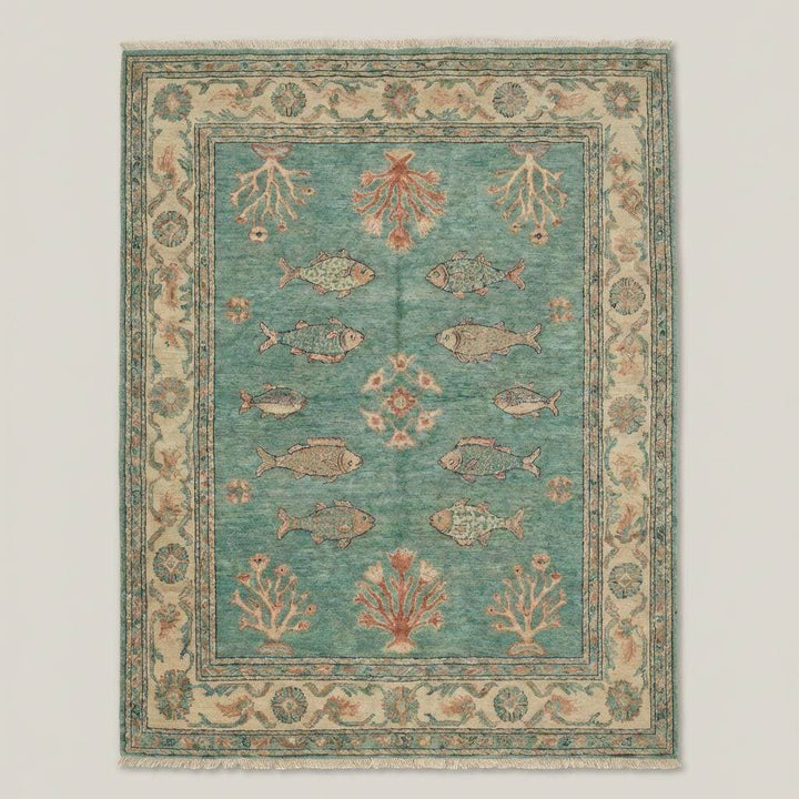Translation missing: en.Teal blue handmade wool rug styled in living room with natural wood flooring