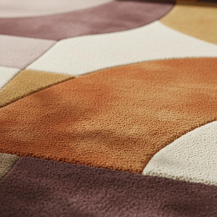 Translation missing: en.Plush hand tufted abstract area rug with geometric retro color blocks in mauve, lilac, peach, terracotta, mustard, and cream tones