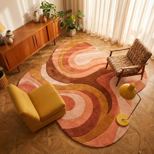 Translation missing: es.Mid century modern rug with retro geometric wave design and organic curved edges in warm terracotta and brown tones