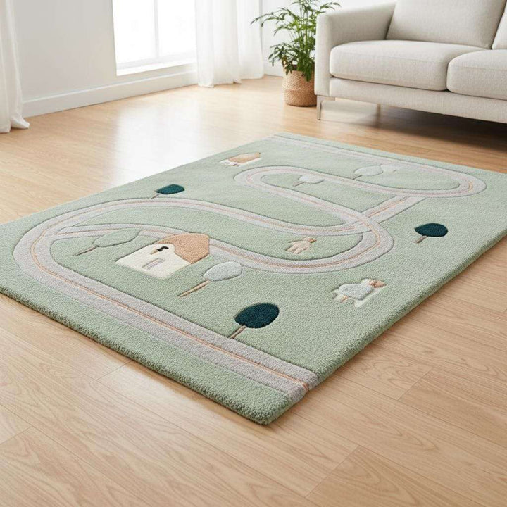 Translation missing: es.Handcrafted hand-tufted wool rug, sage green colour scheme with whimsical road map motif, matching pastel décor, gift idea for new parents