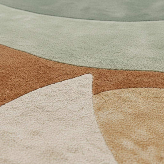 Translation missing: en.Round hand-tufted wool rug with sage terracotta geometric circle design