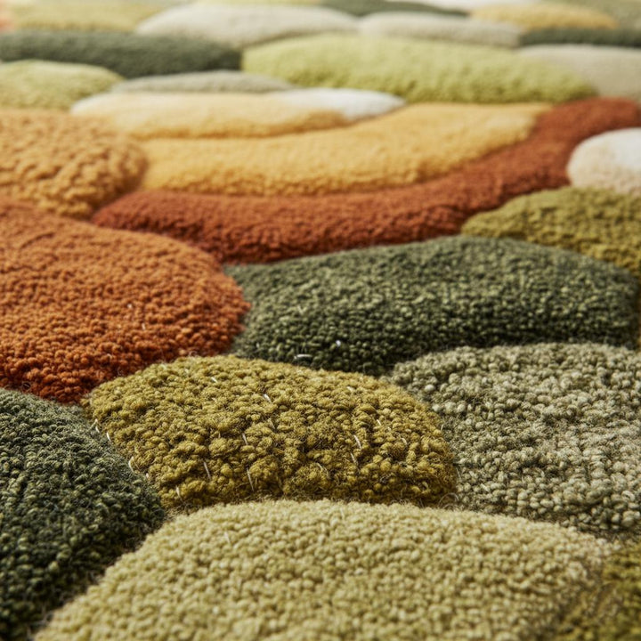 Translation missing: es.Round moss rug with high pile and 3D pebble stone carpet design for cozy living room decor