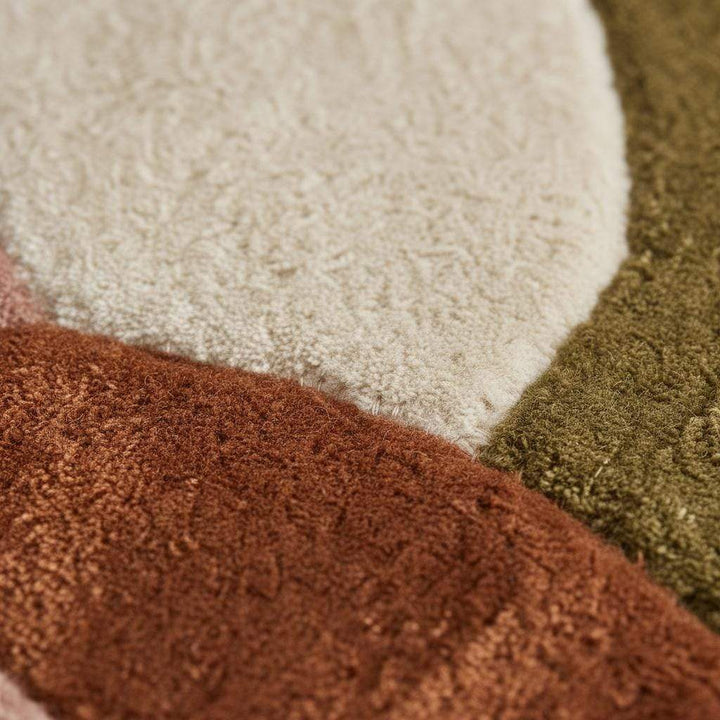 Translation missing: en.Round retro geometric wool rug with thick pile in earthy tones for cozy living room decor