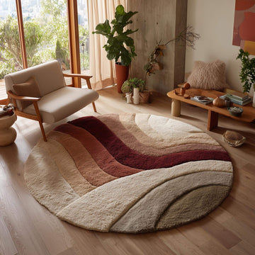 Translation missing: es.Round tufted wool rug with sunset earth tones and plush soft pile in circular shape