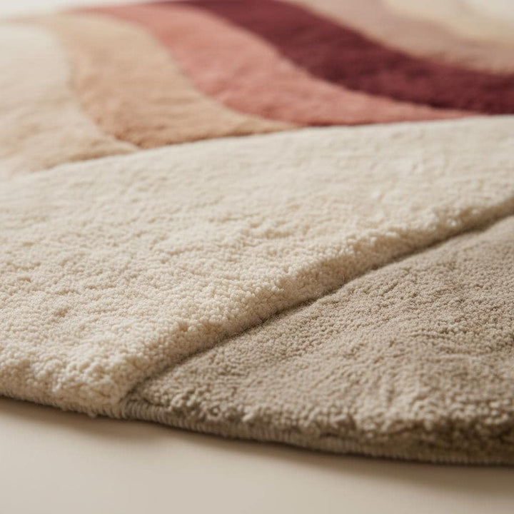 Translation missing: en.Round tufted wool rug with sunset earth tones and plush soft pile in circular design