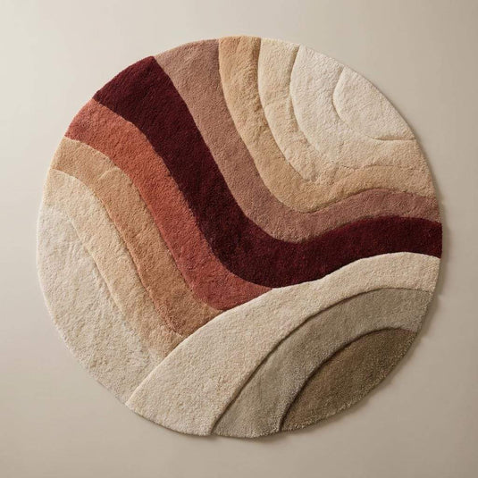 Translation missing: es.Round tufted wool rug in sunset earth tones with plush soft pile and textured circular pattern