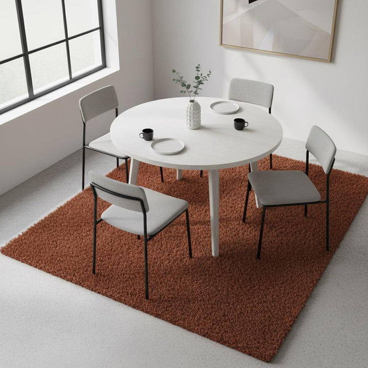 Translation missing: es.Rust shag rug in cozy living room with high pile vintage style and retro orange accents