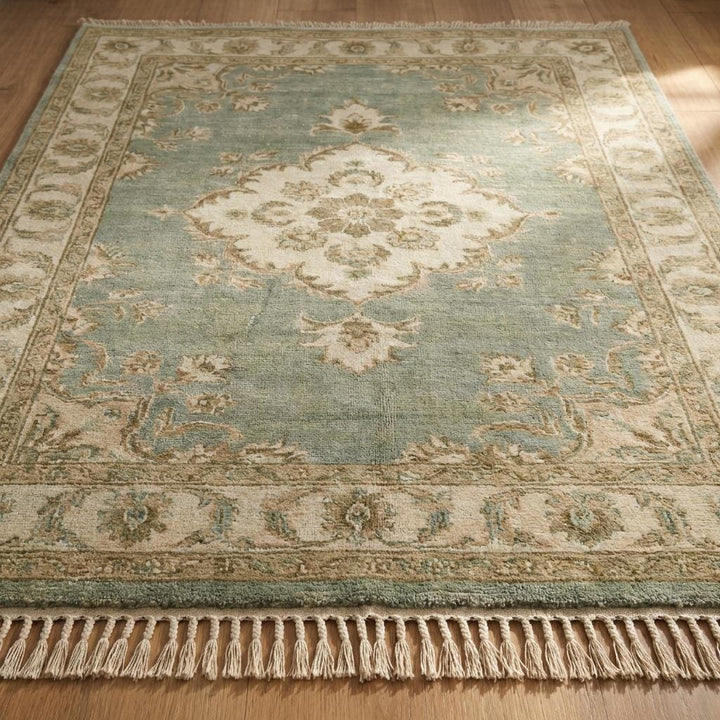 Translation missing: en.Natural wool hand knotted rug with subtle color variation and timeless floral Oushak pattern