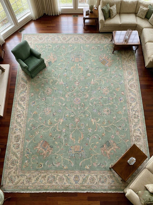 Translation missing: es.Sage green Persian wool area rug with hand-knotted floral and elephant motifs