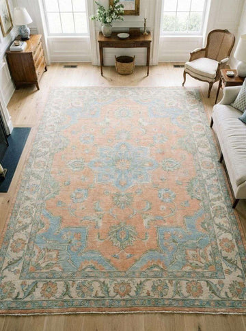 Translation missing: es.Soft peach Oushak area rug with blue medallion, hand knotted wool Persian design