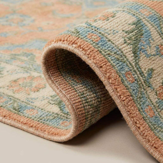 Translation missing: en.Close up of hand knotted wool pile showing natural fibers and artisan knot structure