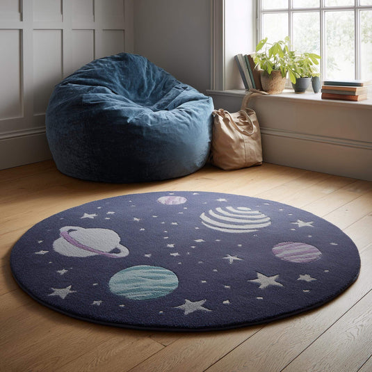 Translation missing: es.Space theme round rug with astronaut and planet design in navy wool nursery decor