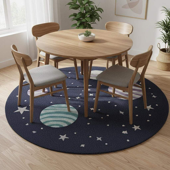 Translation missing: es.Space theme round rug with astronaut and planet design in navy blue wool for nursery decor
