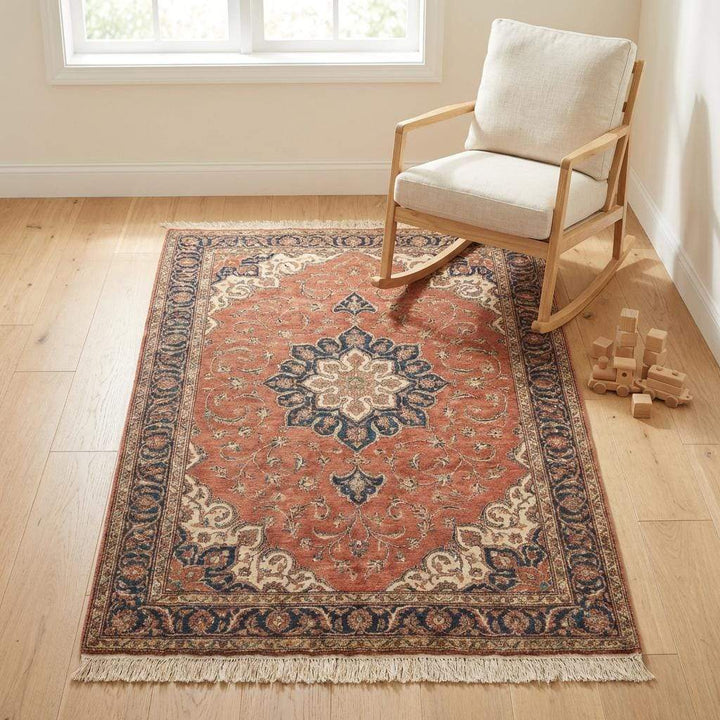 Translation missing: es.Wide shot of a bright living room featuring a large red traditional rug, showing how the medallion centers the furniture arrangement