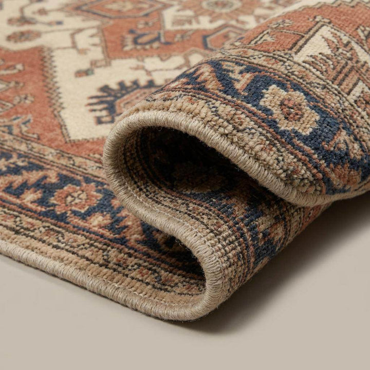 Translation missing: en.Close-up of hand knotted wool rug showing dense pile, individual knots, and natural wool fiber texture