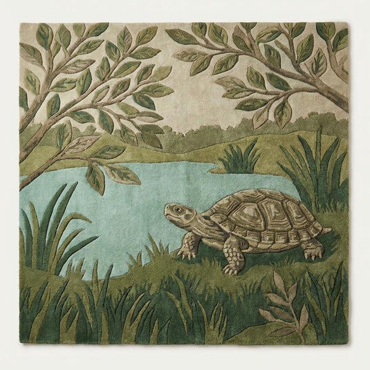 Translation missing: es.Top-down view of turtle pond botanical area rug displaying full woodland design with aqua pond, leafy branches, sculpted turtle, and soft green background