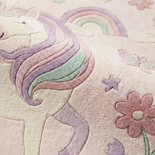 Translation missing: es.Close-up of plush pastel unicorn rug fibers showing soft tufted texture, raised design details, and cushioned pile for nursery or kids room flooring