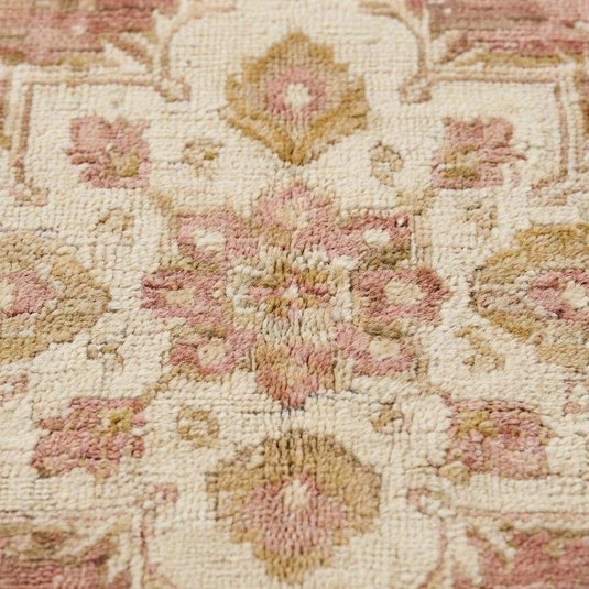 Translation missing: en.Close-up of hand knotted wool pile showing low pile texture, natural fibers, and subtle abrash variations