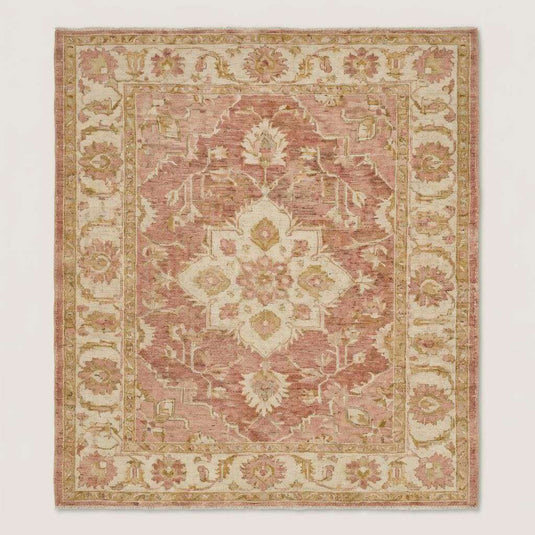 Translation missing: en.Blush pink and ivory Oushak style wool area rug with traditional floral motifs and faded vintage look