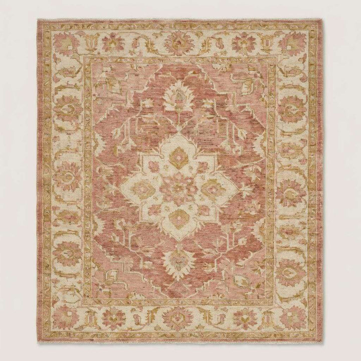 Translation missing: en.Blush pink and ivory Oushak style wool area rug with traditional floral motifs and faded vintage look