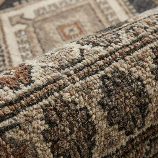 Translation missing: en.Close-up of hand knotted wool rug showing dense knot structure, natural wool fibers, and artisan craftsmanship