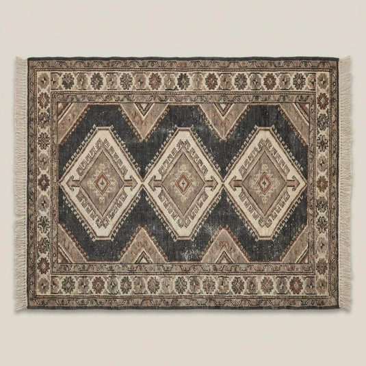 Translation missing: en.Rustic hand knotted tribal rug styled in farmhouse interior with stone flooring and wood beams