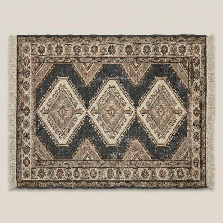 Translation missing: en.Rustic hand knotted tribal rug styled in farmhouse interior with stone flooring and wood beams