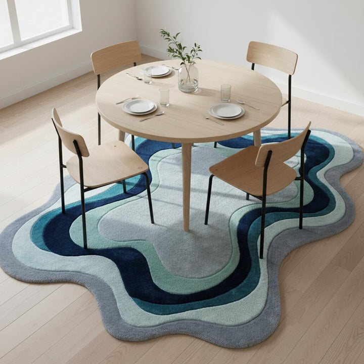 Translation missing: es.Custom irregular abstract rug with layered wavy pattern displayed in a comfortable living space with neutral seating