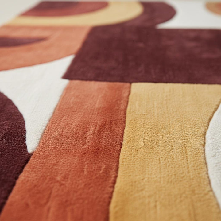 Translation missing: en.Mid century modern rug with geometric terracotta and mustard tones in living room setting