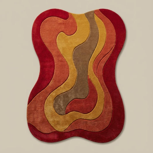 Translation missing: en.Colorful abstract freeform rug with red, orange, gold, and brown waves adding a groovy retro look to a cozy modern interior setting