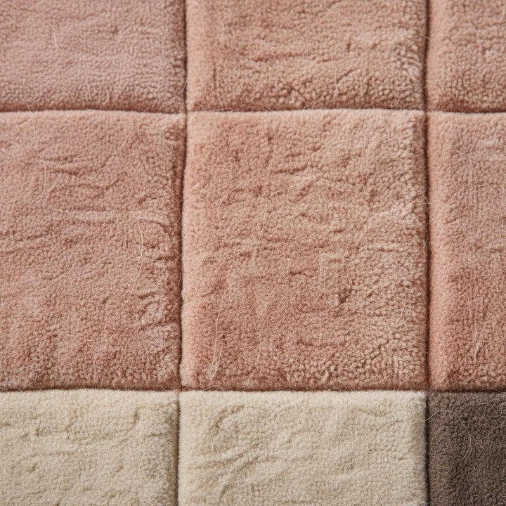 Translation missing: en.Modern geometric rug with plush pink neutral tones and textured grid pattern
