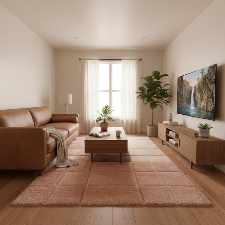Translation missing: en.Contemporary accent rug with soft pastel tones and a grid layout, photographed in a stylish reading or lounge corner