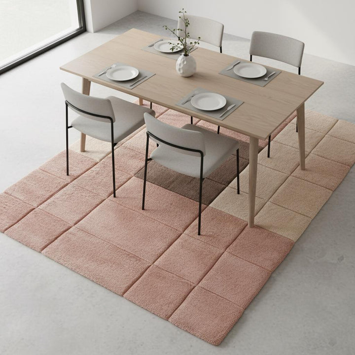 Translation missing: en.Warm neutral and blush modern rug with subtle geometric shapes enhancing a minimalist interior setting