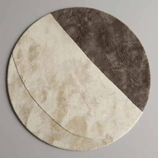 Translation missing: en.Soft plush round rug featuring a half-moon cream and taupe pattern styled with modern furniture, neutral home décor aesthetic