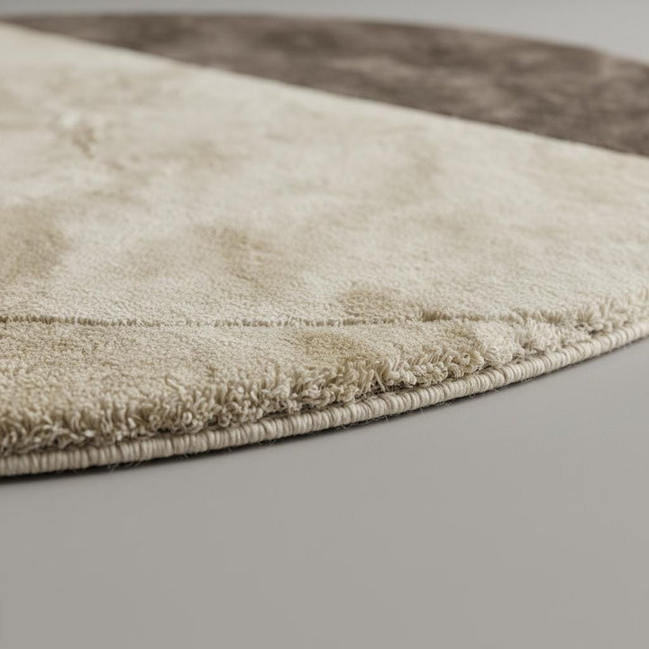 Translation missing: en.Modern round area rug with two tone cream and taupe colors and plush tufted texture