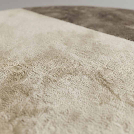 Translation missing: en.Modern round area rug in two tone cream and taupe with plush tufted texture and geometric pattern