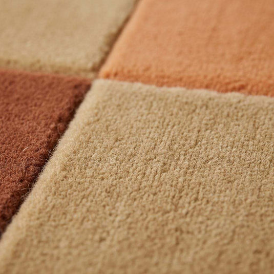 Translation missing: en.Mid century rug with geometric color block design in warm ochres and rust tones for modern living room