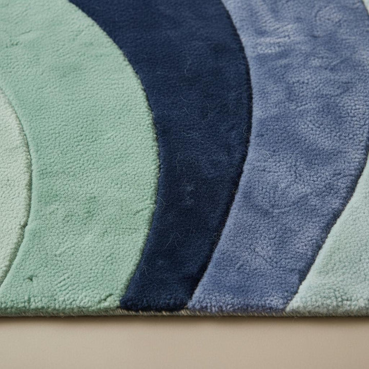 Translation missing: en.Modern abstract wave rug with sculpted pile and soft plush comfort in mint, navy, and blue tones