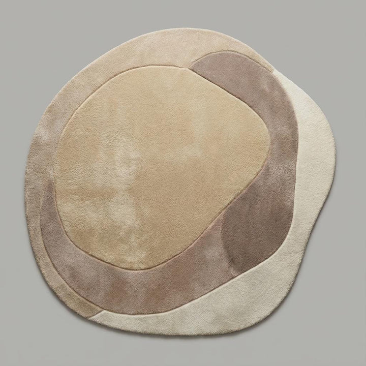 Translation missing: en.Neutral curved beige and cream rug with sculpted texture styled in a modern Scandinavian living space