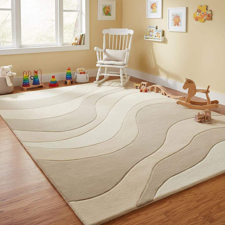 Translation missing: en.Contemporary wavy area rug in soft beige and cream hues creating a calming, textured focal point in a modern home