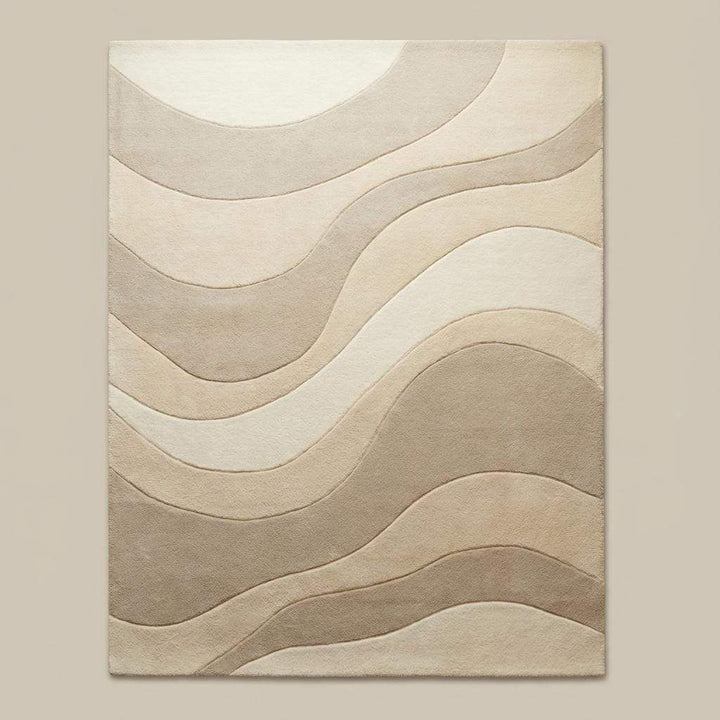 Translation missing: en.Textured beige and cream rug featuring flowing wave pattern placed under a light wood coffee table in a clean contemporary home