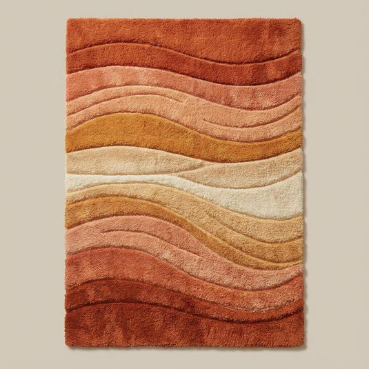 Translation missing: en.Retro boho wave rug featuring terracotta, rust, and cream curves, plush texture shown in natural sunlight