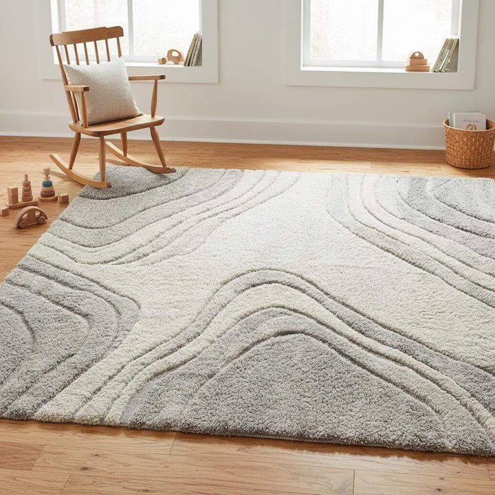 Translation missing: en.Contemporary textured rug featuring abstract flowing lines in a modern home interior