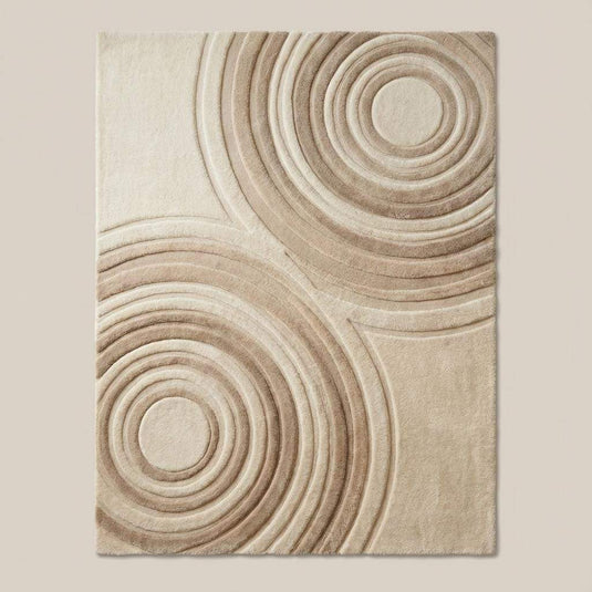 Translation missing: es.Textured beige and ivory area rug featuring concentric circle design in a modern Japandi-style interior